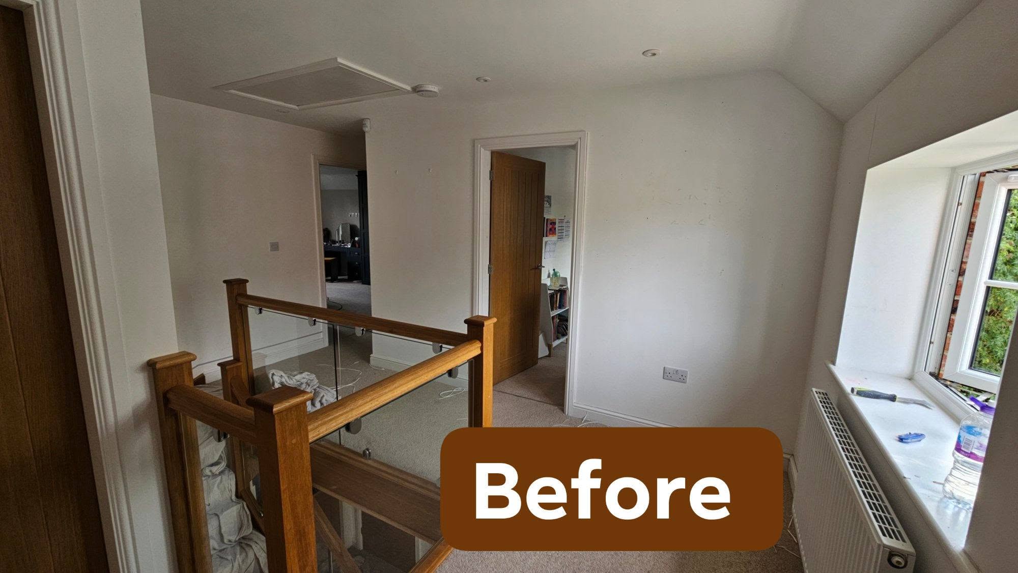 Landing before, white walls and a dormer window