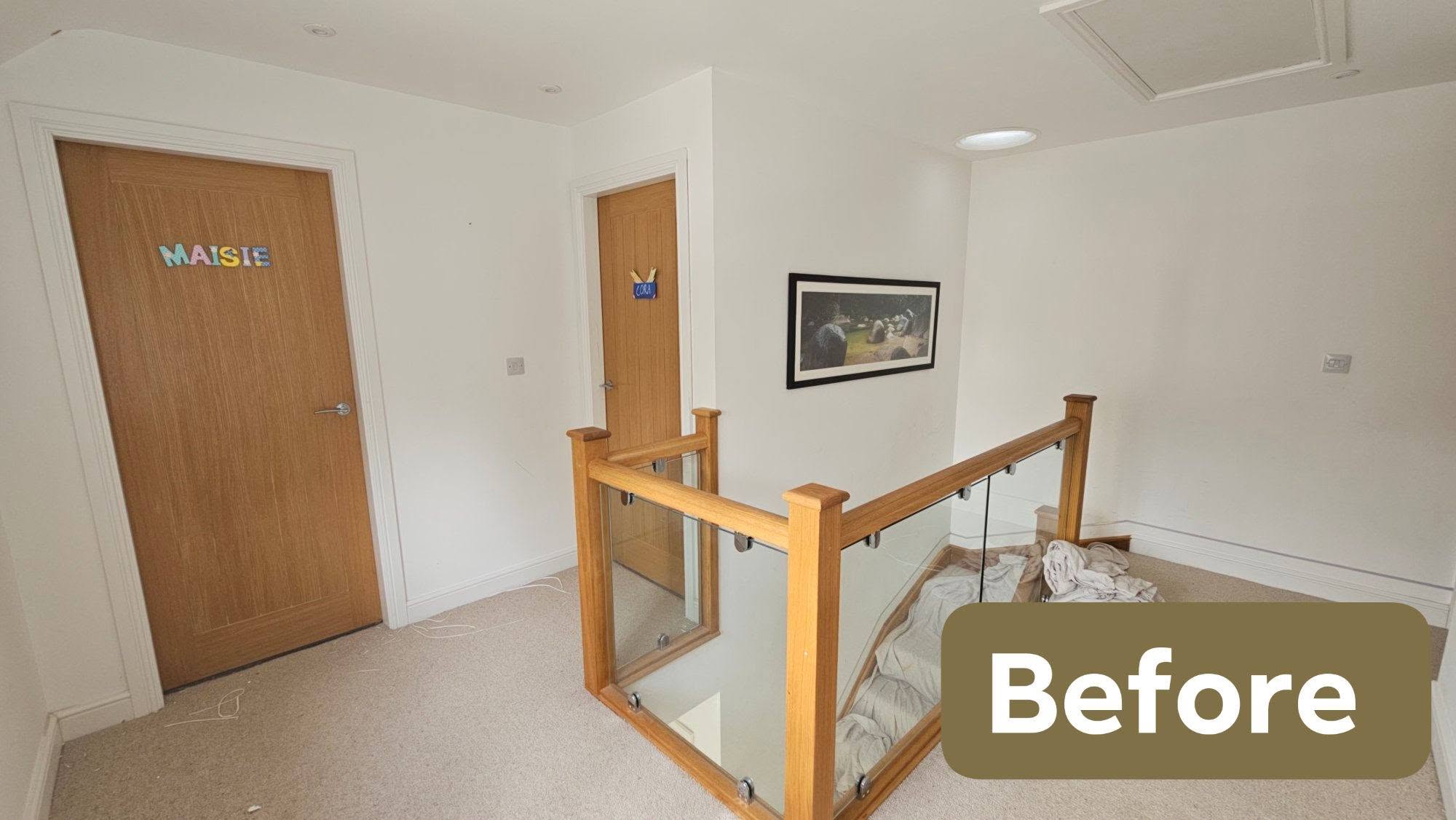 Landing before, bedroom doors and white walls