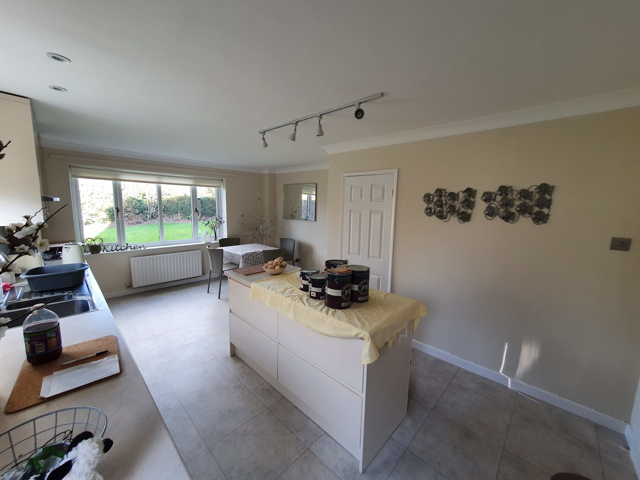 Open-plan kitchen-diner freshly painted in a warm neutral